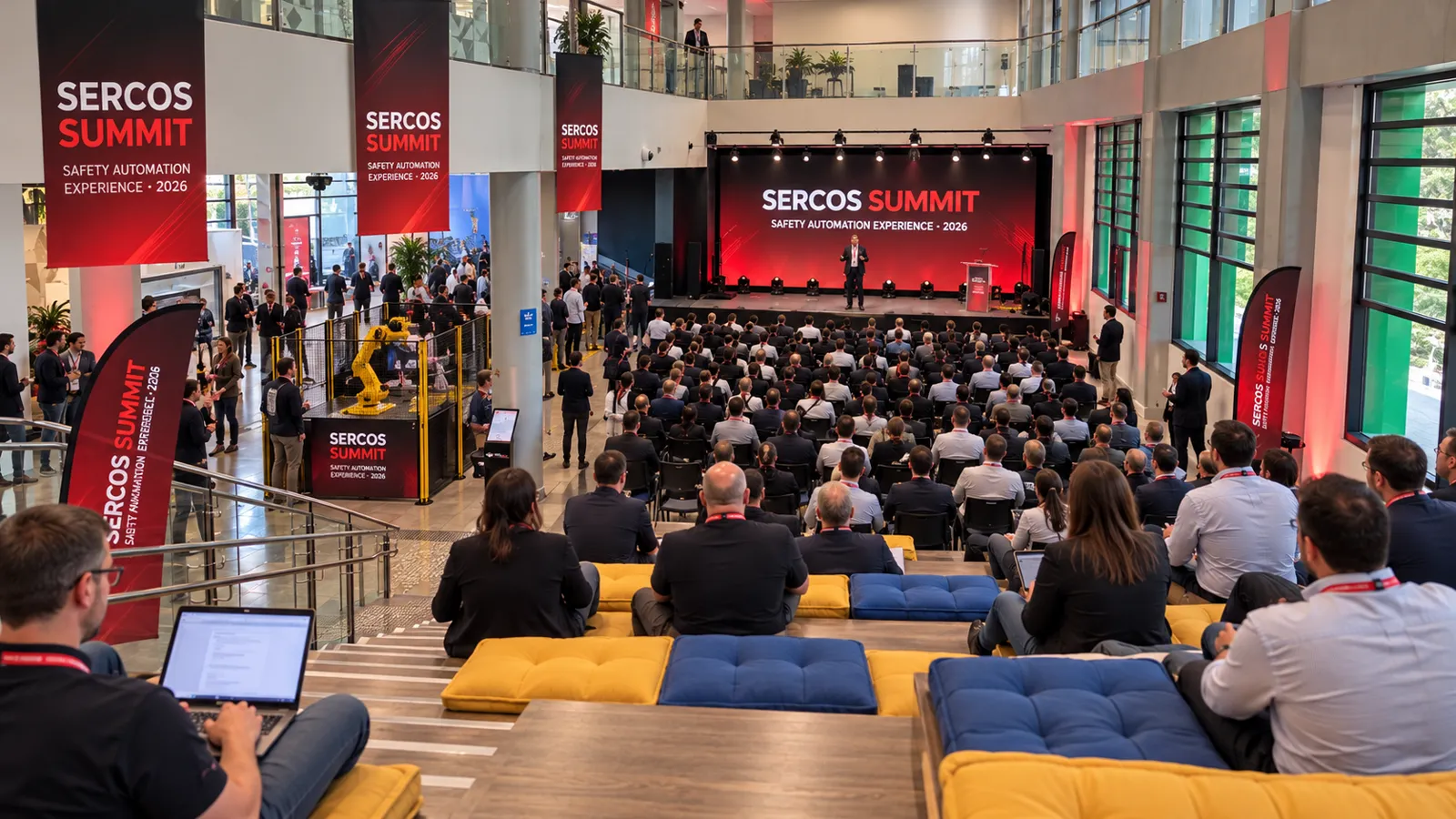 Ilustração do palco do Sercos Summit com plateia assistindo a uma palestra